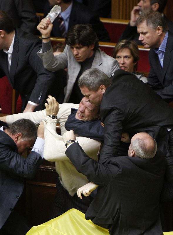 Deputies scuffle during a session in the chamber of the Ukrainian parliament in Kiev