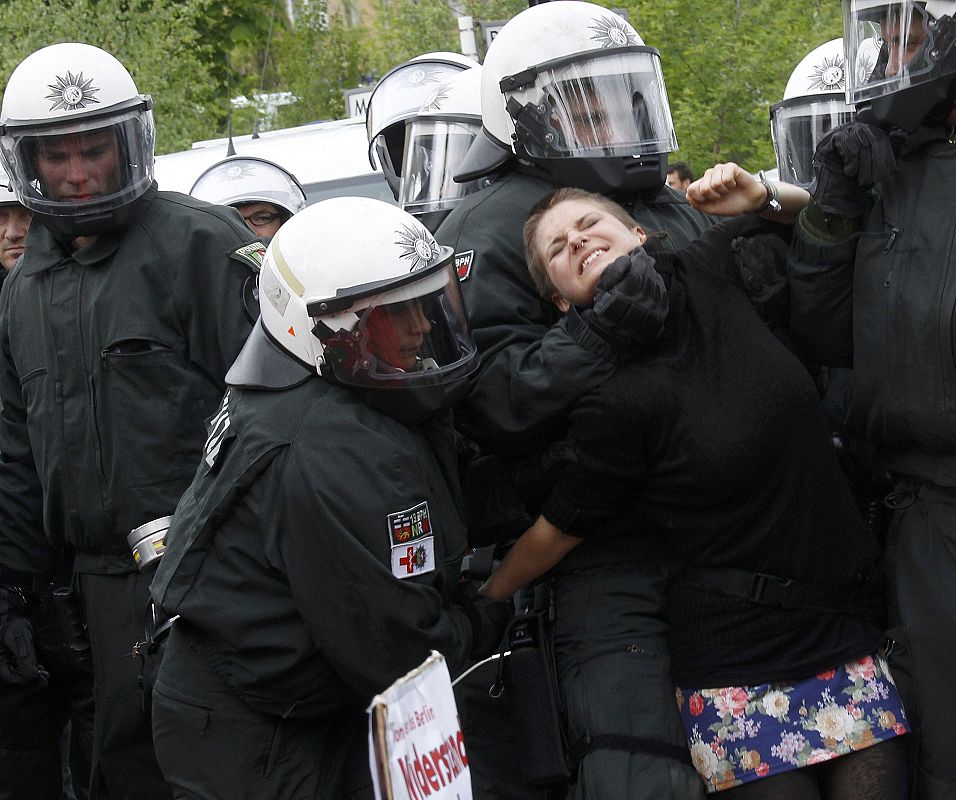 German riot police remove a left-wing protestor during a May Day demonstration in Berlin