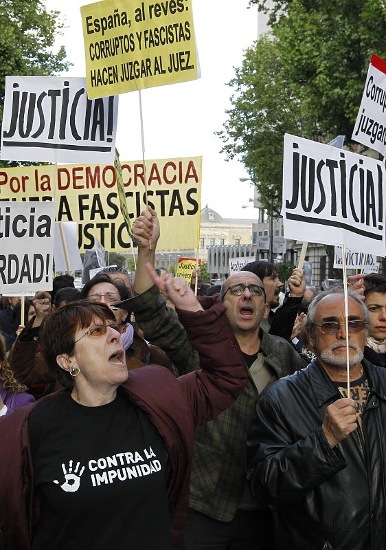 People take part in a demonstration in support of Spanish High Court judge Baltasar Garzon in Madrid
