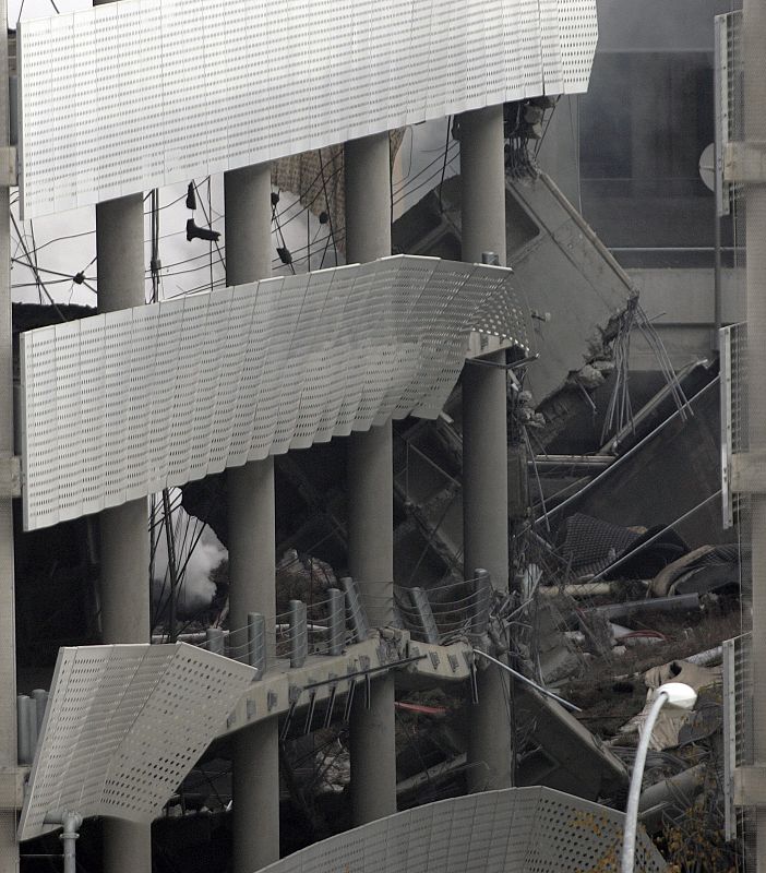 View of damage caused by car bomb explosion in one of the parking lots of Madrid's Barajas airport