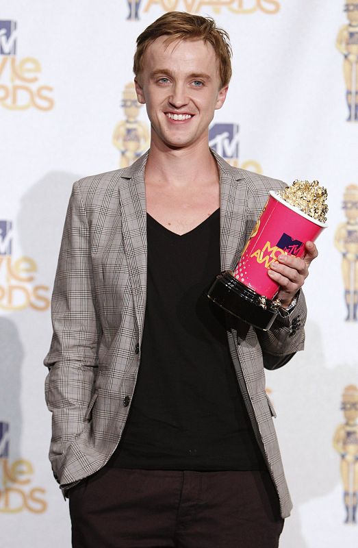 Felton, winner of the Best Villain award for 'Harry Potter and the Half-Blood Prince,' poses at the 2010 MTV Movie Awards in Los Angeles