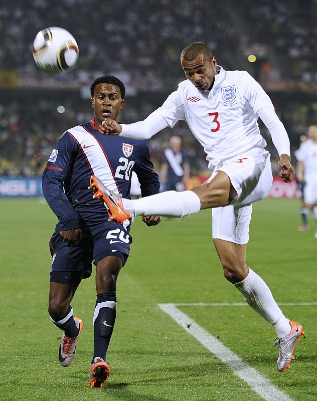 England's Ashley Cole fights for the ball with Robbie Findley of the US during a 2010 World Cup Group C soccer match at Royal Bafokeng stadium