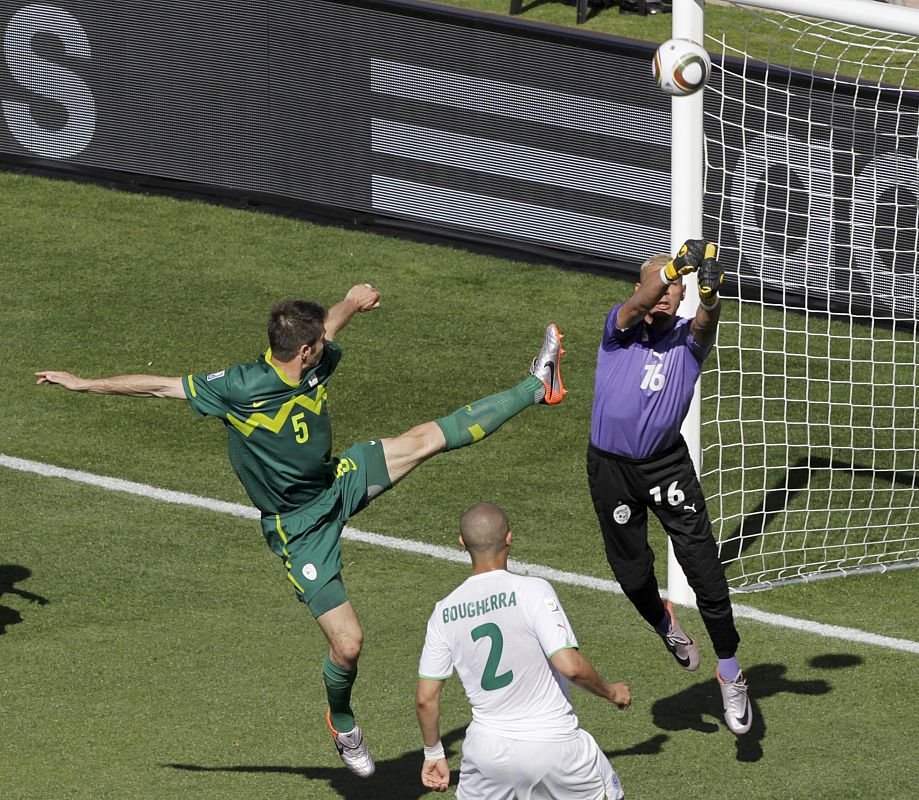 Algeria's goalkeeper Chaouchi makes a save against Slovenia's Cesar during the 2010 World Cup Group C soccer match at Peter Mokaba stadium in Polokwane