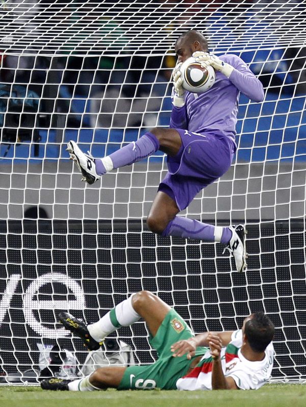 Ivory Coast's goalkeeper Boubacar Barry makes a save as Portugal's Liedson watches during a 2010 World Cup Group G soccer match