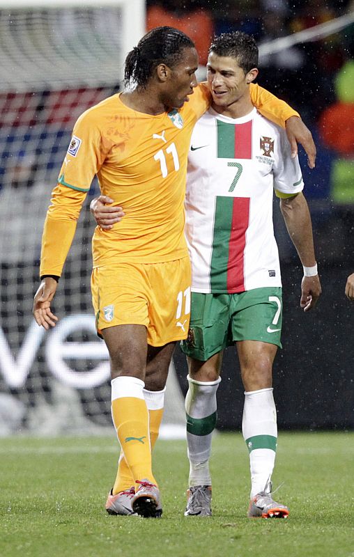 Ivory Coast's Didier Drogba walks with Portugal's Cristiano Ronaldo during a 2010 World Cup Group G soccer match at Nelson Mandela Bay stadium