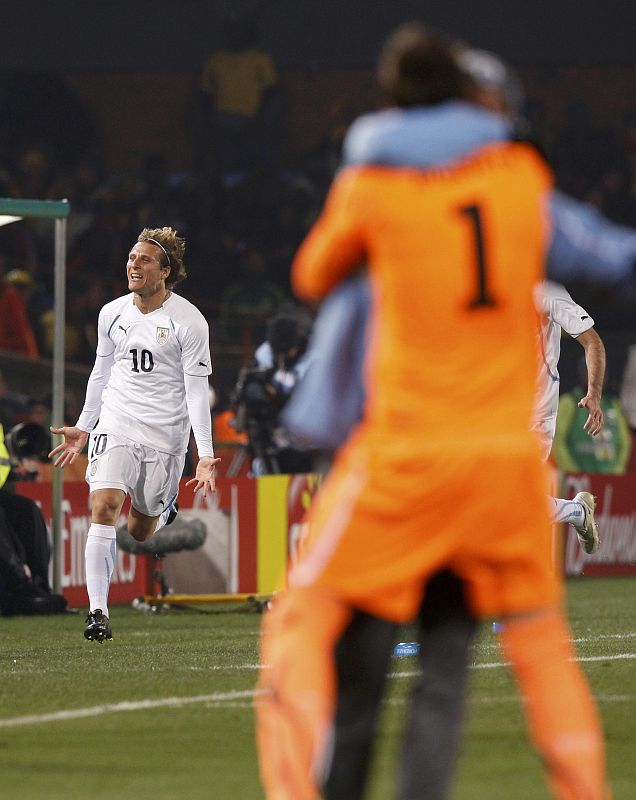 Uruguay's Forlan celebrates scoring against South Africa during a 2010 World Cup Group A soccer match in Pretoria