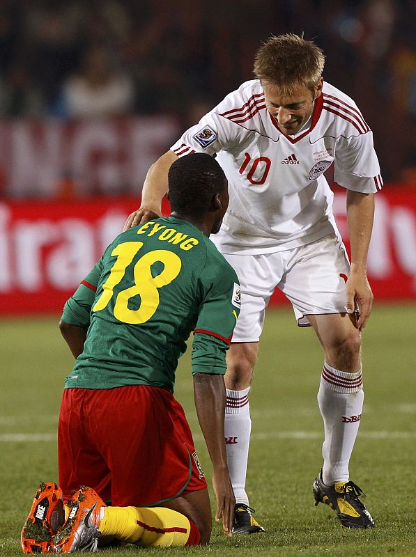 Denmark's Jorgensen speaks to Cameroon's Eyong during a 2010 World Cup Group E soccer match at Loftus Versfeld stadium in Pretoria