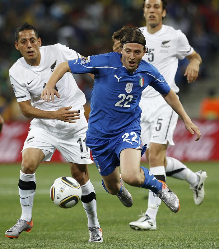 Italy's Riccardo Montolivo fights for the ball with New Zealand's Leo Bertos during their 2010 World Cup Group F soccer match at Mbombela stadium in Nelspruit