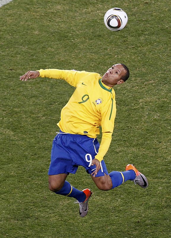 Brazil's Luis Fabiano heads for the ball during a 2010 World Cup Group G soccer match against Ivory Coast at Soccer City stadium in Johannesburg