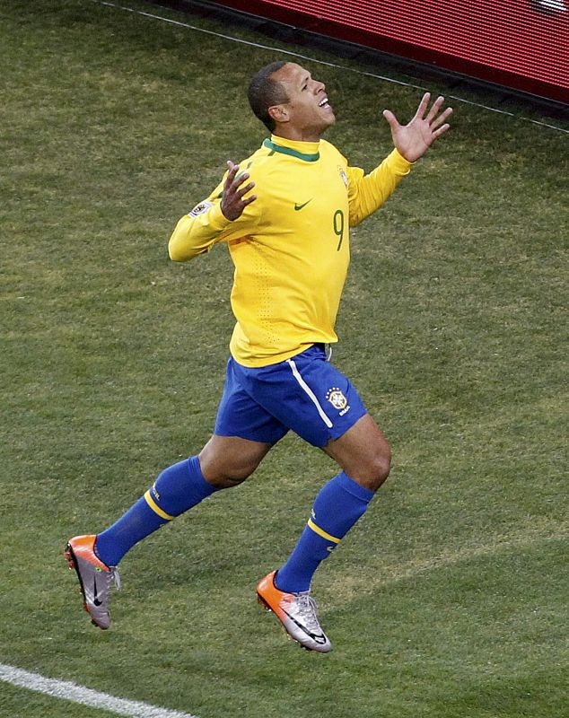 Brazil's Luis  Fabiano celebrates after scoring a goal during a 2010 World Cup Group G soccer match against Ivory Coast in Johannesburg