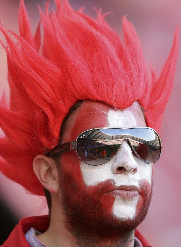 A fan waits fot the start of the 2010 World Cup Group H match between Chile and Switzerland at Nelson Mandela Bay stadium in Port Elizabeth