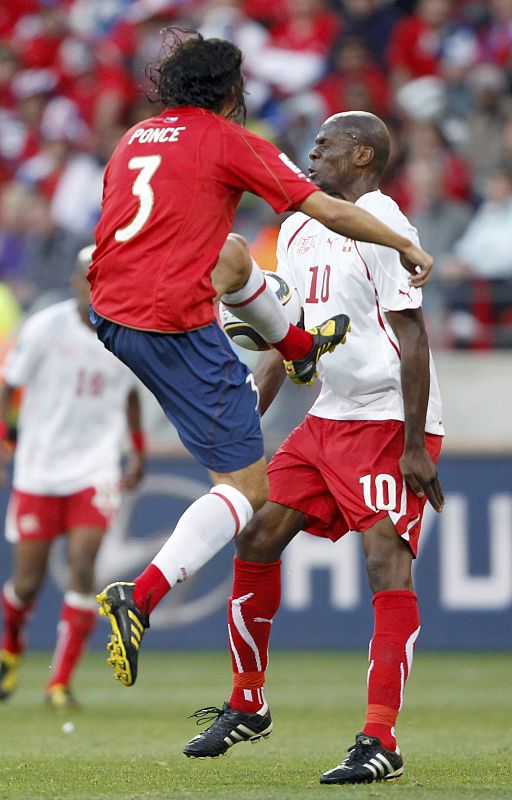 Chile's Waldo Ponce fouls Switzerland's Blaise Nkufo during a 2010 World Cup Group H match at Nelson Mandela Bay stadium in Port Elizabeth