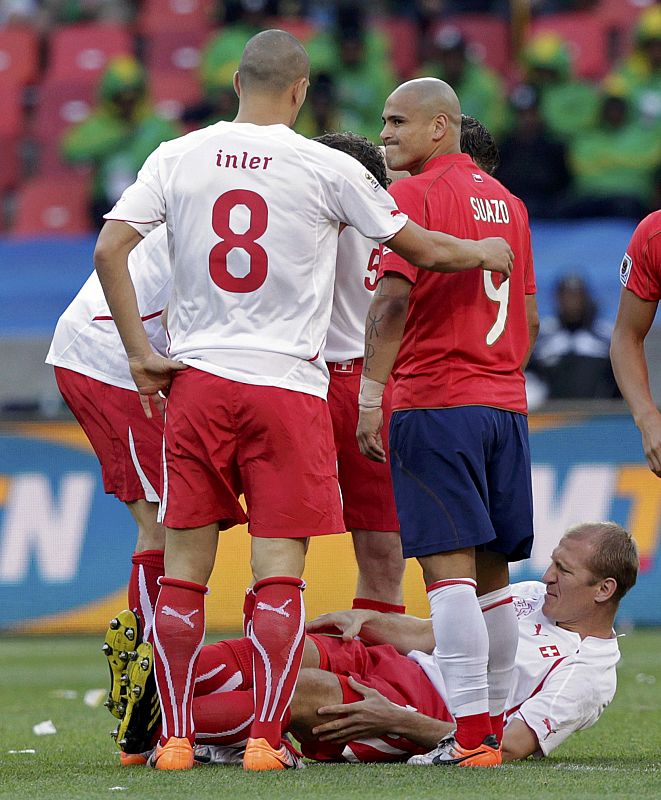 Chile's Suazo looks at Switzerland's Inler after a foul during a 2010 World Cup Group H match at Nelson Mandela Bay stadium in Port Elizabeth