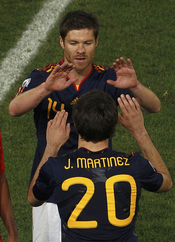 Spain's Xabi Alonso is substituted by teammate Javier Martinez during the 2010 World Cup group H soccer match against Chile at Loftus Versfeld stadium in Pretoria