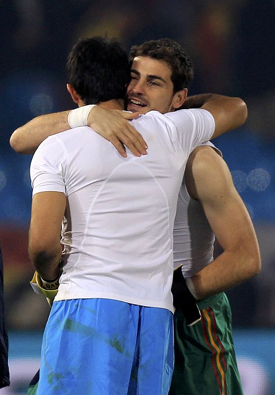 Spain's goalkeeper Iker Casillas hugs a team mate after the team's 2010 World Cup Group H match against Chile at Loftus Versfeld stadium in Pretoria