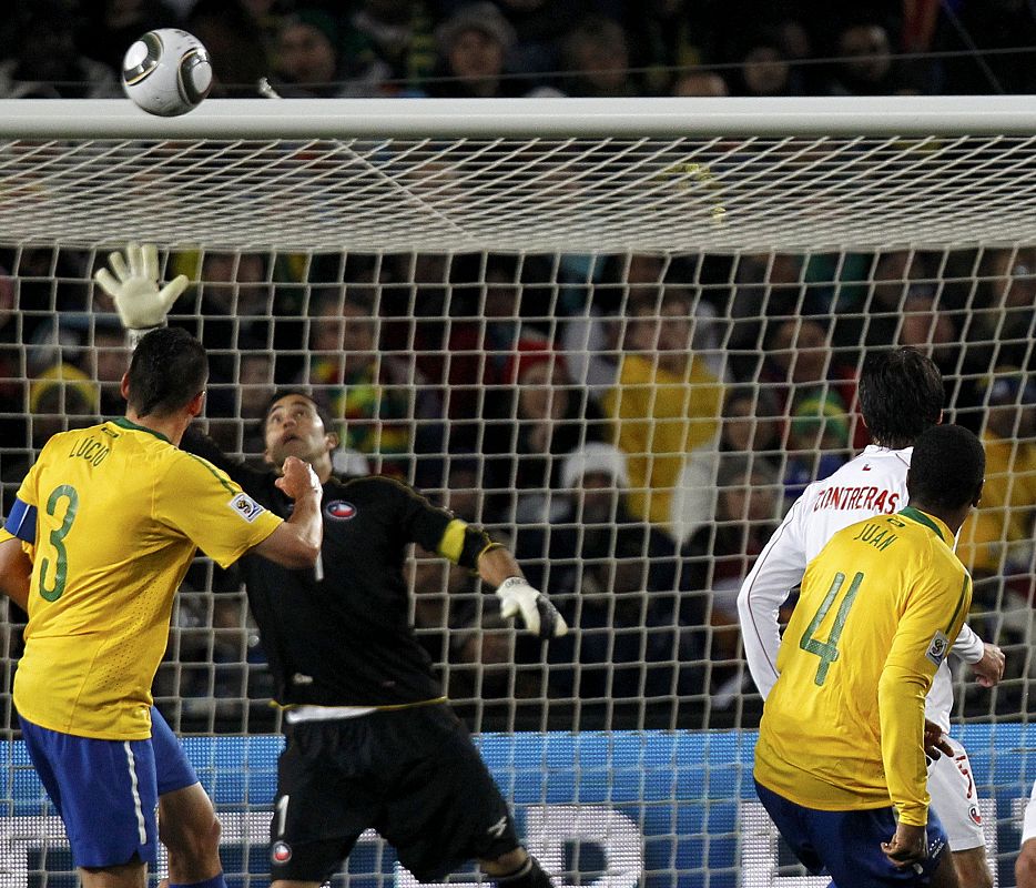 Brazil's Juan heads the ball to score against Chile during a 2010 World Cup second round soccer match at Ellis Park stadium in Johannesburg