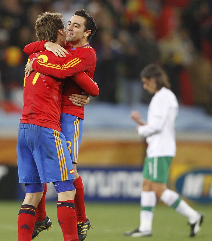 Spain's Llorente hugs Xavi after the 2010 World Cup second round soccer match between Spain and Portugal at Green Point stadium in Cape Town