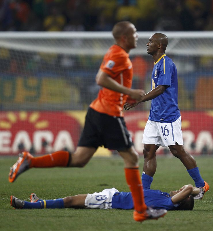 Brazil's Daniel Alves and Gilberto react after the 2010 World Cup quarter-final soccer match between Netherlands and Brazil in Port Elizabeth