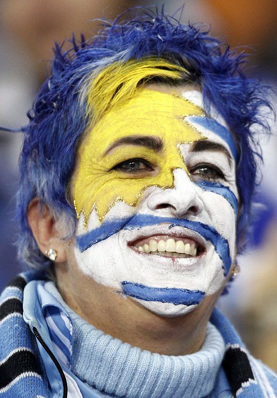 A soccer fan smiles before the start of the 2010 World Cup quarter-final soccer match between Ghana and Uruguay at Soccer City stadium in Johannesburg