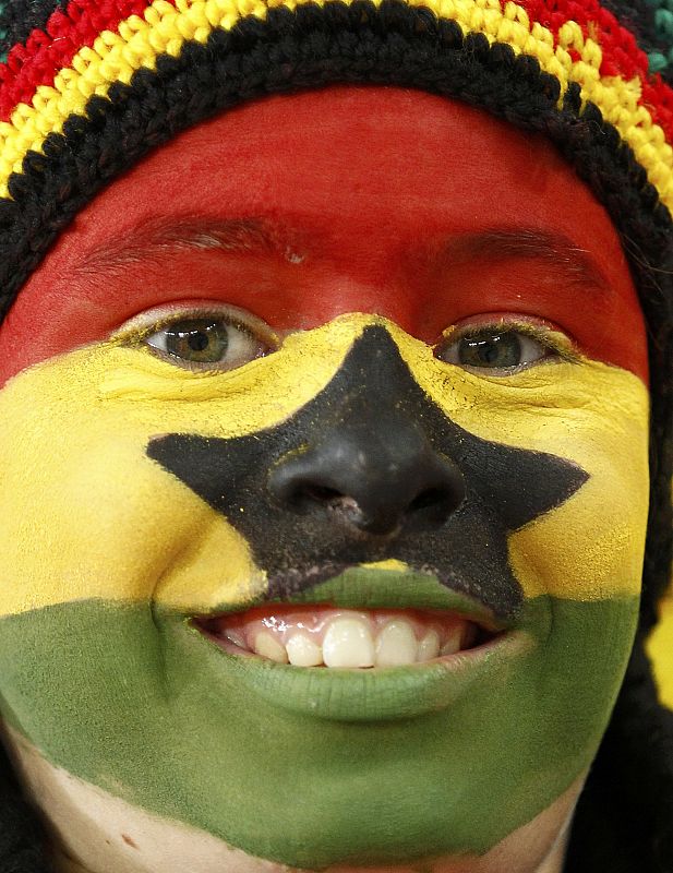 A fan waits for the start of the 2010 World Cup quarter-final soccer match between Uruguay and Ghana at Soccer City stadium in Johannesburg