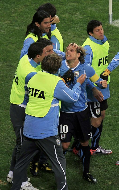 Uruguay's Forlan celebrates after scoring a goal during their 2010 World Cup semi-final soccer match against Netherlands in Cape Town