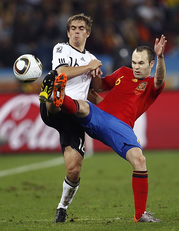 Germany's Philipp Lahm fights for the ball with Spain's Andres Iniesta during their 2010 World Cup semi-final soccer match in Durban