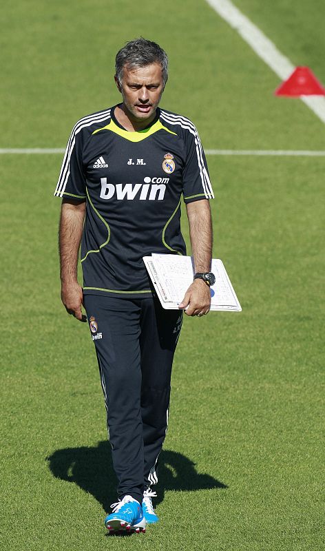 Real Madrid's new coach Mourinho walks during Real Madrid's first training session in Madrid