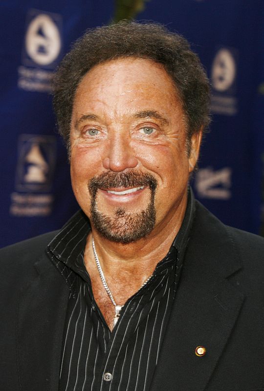 Singer Tom Jones poses as he arrives at the Grammy Foundation's Starry Night gala in Los Angeles