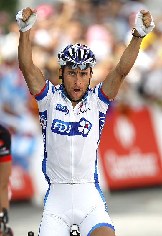 Francaise des Jeux team rider Sandy Casar of France celebrates as he crosses the finish line to win the ninth stage of the Tour de France cycling race between Morzine-Avoriaz and Saint-Jean-De-Maurienne
