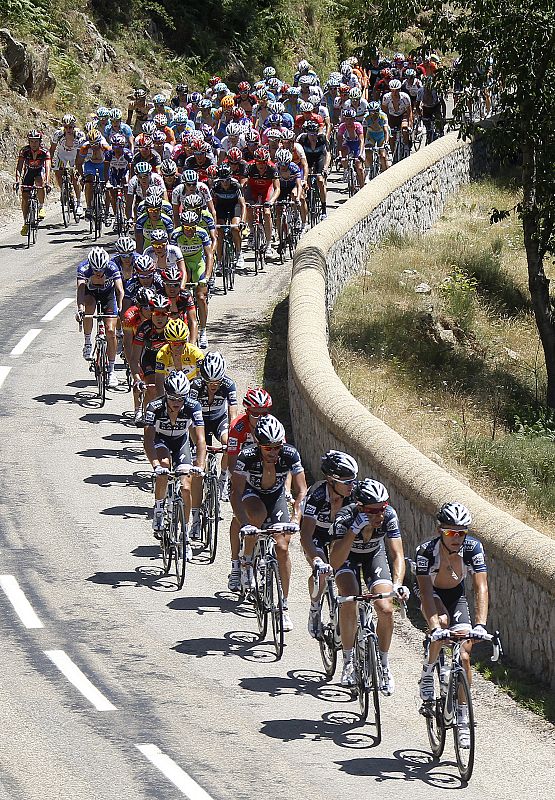 The peloton cycles during the 12th stage of the Tour de France cycling race between Bourg-de-Peage and Mende