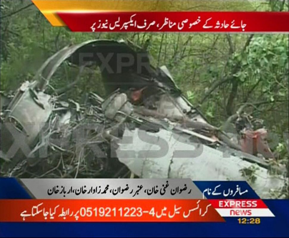 A video grab shows the wreckage of a commercial Pakistani passenger plane in hills near the capital Islamabad