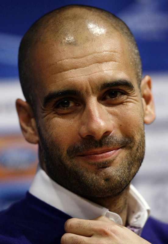 Barcelona's coach Pep Guardiola attends a news conference at Camp Nou stadium in Barcelona