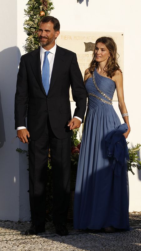 Spain's Crown Prince Felipe and Princess Letizia arrive at Agios Nikolaos church to attend the wedding ceremony of Prince Nikolaos and Tatiana Blatnik on the island of Spetses