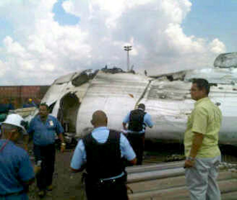 A picture shows rescue workers at the place where an ATR-42 plane crashed in Puerto Ordaz