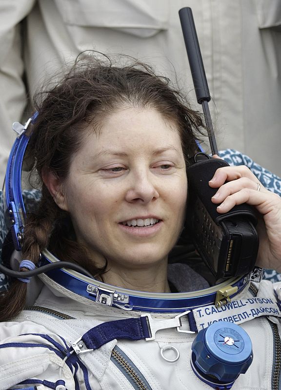 U.S. astronaut Tracy Caldwell Dyson speaks on a satellite phone after landing near the town of Arkalyk, northern Kazakhstan