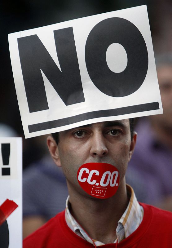 A man takes part in a protest during a nationwide general strike in central Madrid