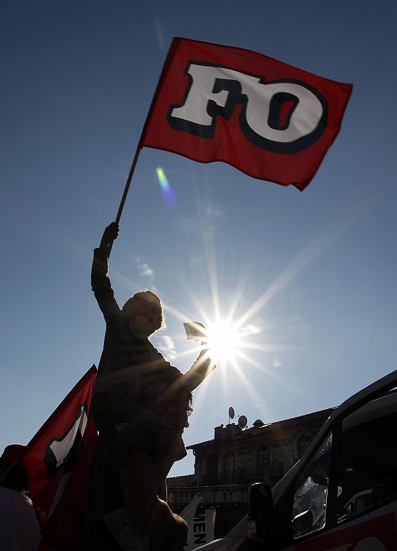 A boy waves a union flag during a demonstration in Nice