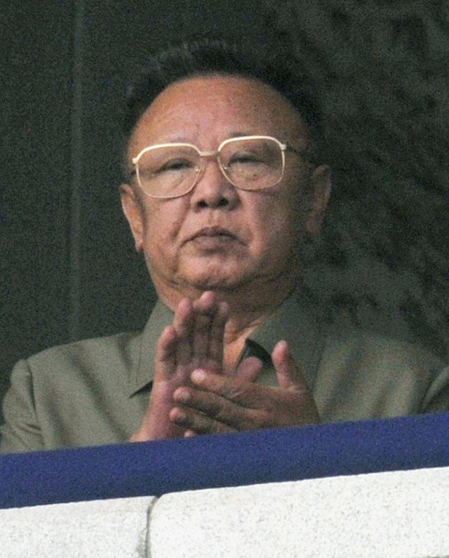 North Korean leader Kim Jong-il claps as he watches a parade in Pyongyang
