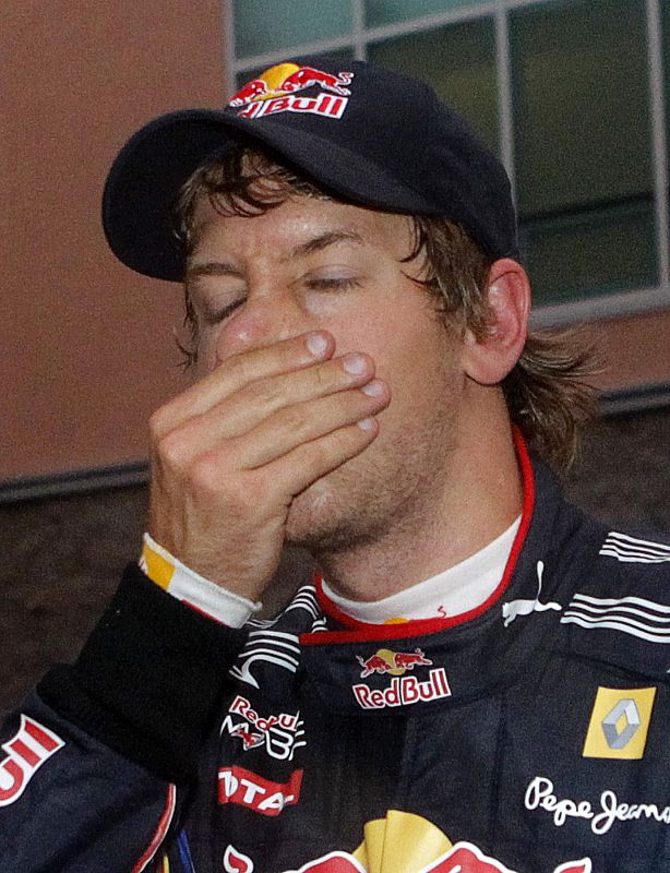 Red Bull Formula One driver Vettel of Germany reacts in the paddock after he retired from the South Korean F1 Grand Prix at the Korea International Circuit in Yeongam