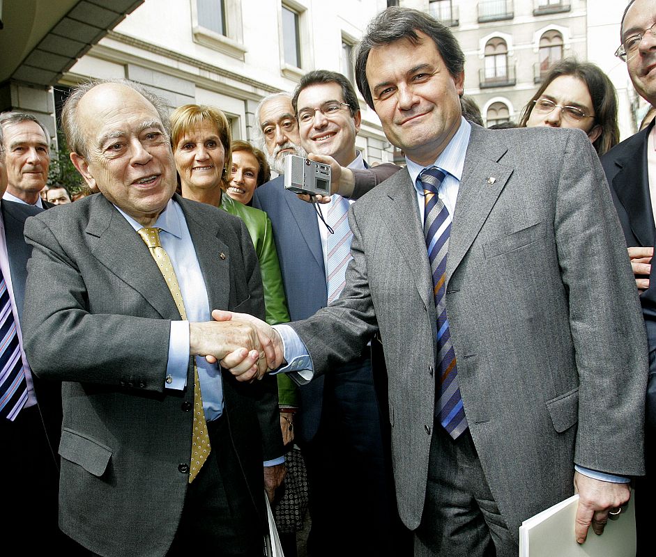 Catalan representatives celebrate after a parliamentary session in Madrid