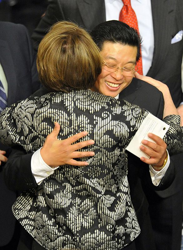 Tiananmen Square activist Yang Jianli of China hugs the speaker of the US House of Representatives Pelosi before the Nobel Peace Prize ceremony in Oslo