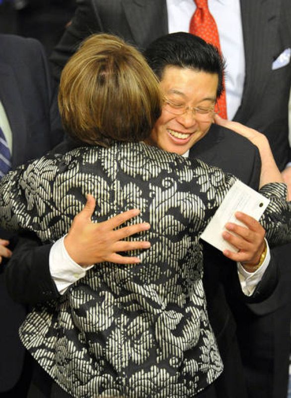 Tiananmen Square activist Yang Jianli of China hugs the speaker of the US House of Representatives Pelosi before the Nobel Peace Prize ceremony in Oslo