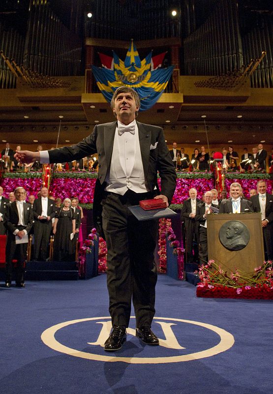 Russian-born physicist Geim bows after receiving the 2010 Nobel Prize in Physics from Sweden's King Carl XVI Gustaf at the Concert Hall in Stockholm