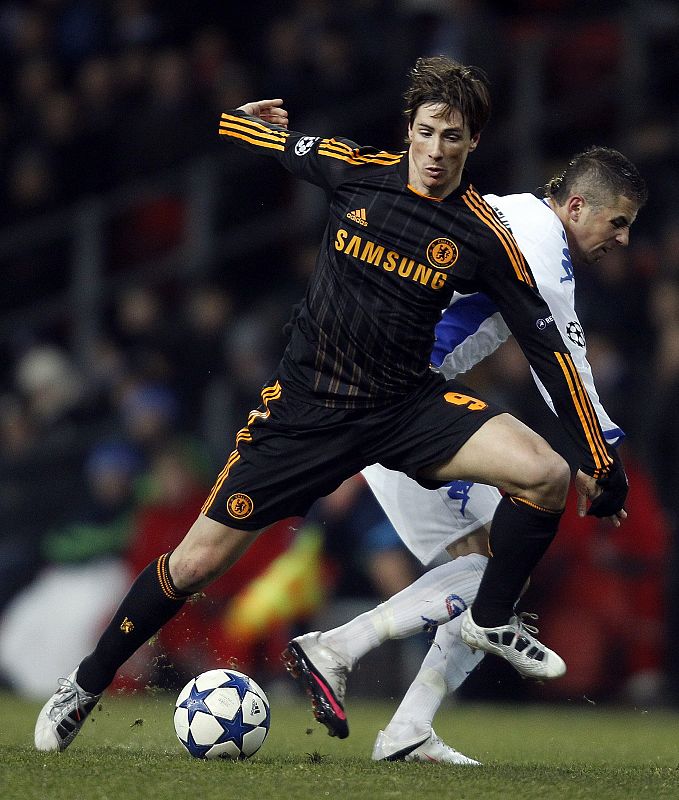 FC Copenhagen's Claudemir challenges Chelsea's Torres during their Champions League soccer match at Parken stadium in Copenhagen