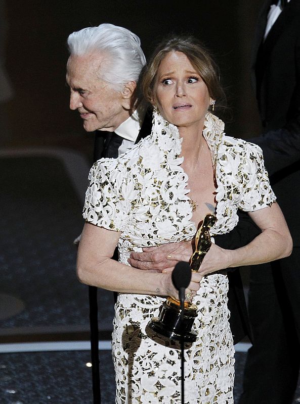 Melissa Leo accepts the Oscar for best supporting actress from presenter Kirk Douglas during the 83rd Academy Awards in Hollywood