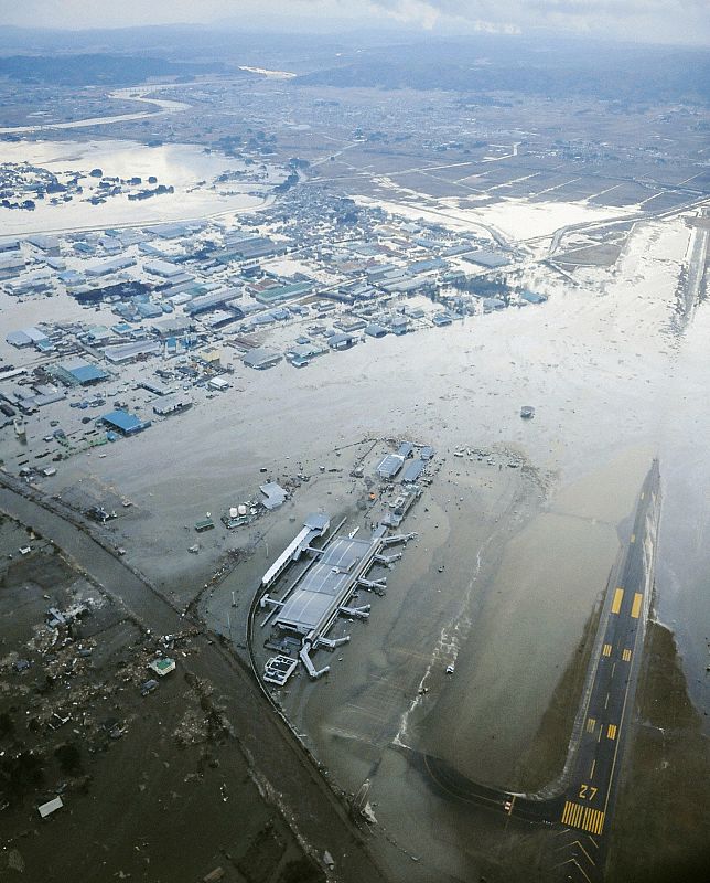 An aerial view of a tsunami swamped Sendai Airport in northeastern Japan