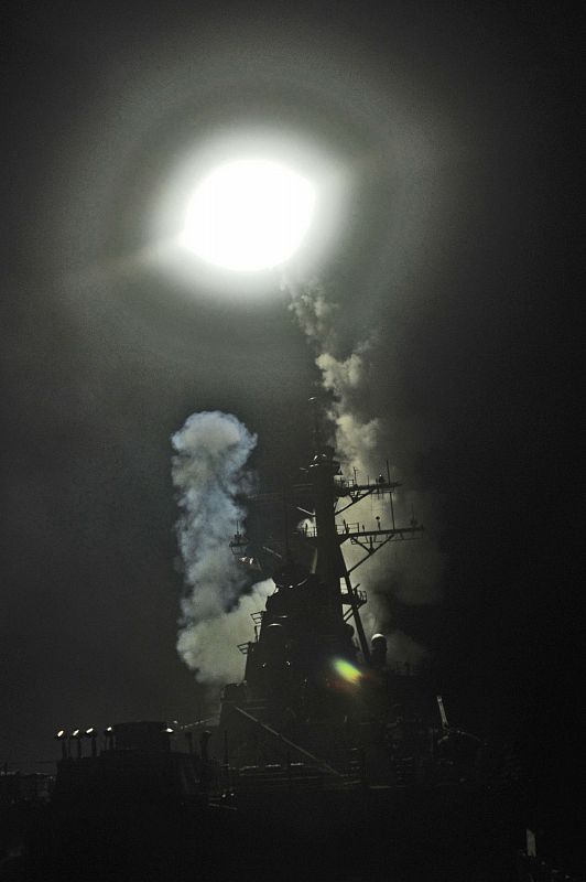 Arleigh Burke-class guided-missile destroyer USS Barry (DDG 52) launches a Tomahawk missile in support of Operation Odyssey Dawn in the Mediterranean Sea