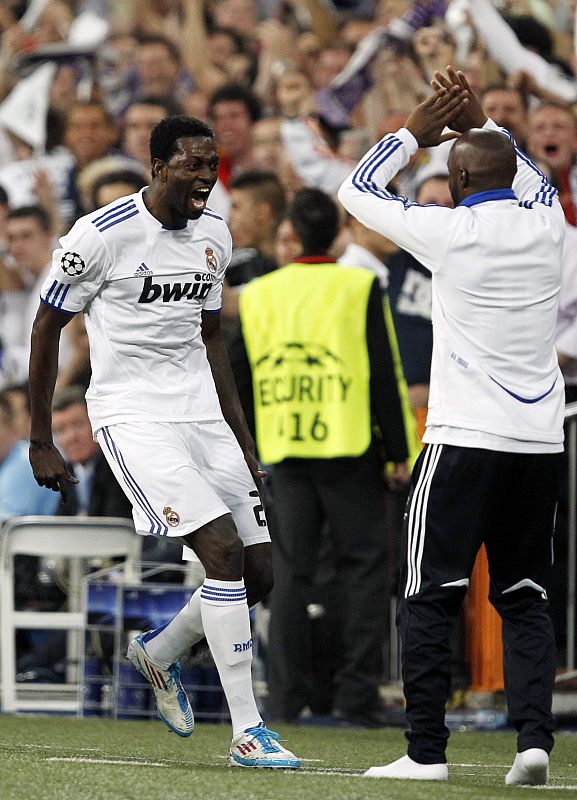 Real Madrid's Adebayor celebrates his goal against Tottenham Hotspur with team mate Diarra during their  first leg of their Champions League quarter-final soccer match against Tottenham Hotspur in Madrid