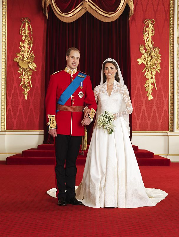 Britain's Prince William and his bride Catherine, Duchess of Cambridge, pose for an official photograph, in the throne room at Buckingham Palace, in central London