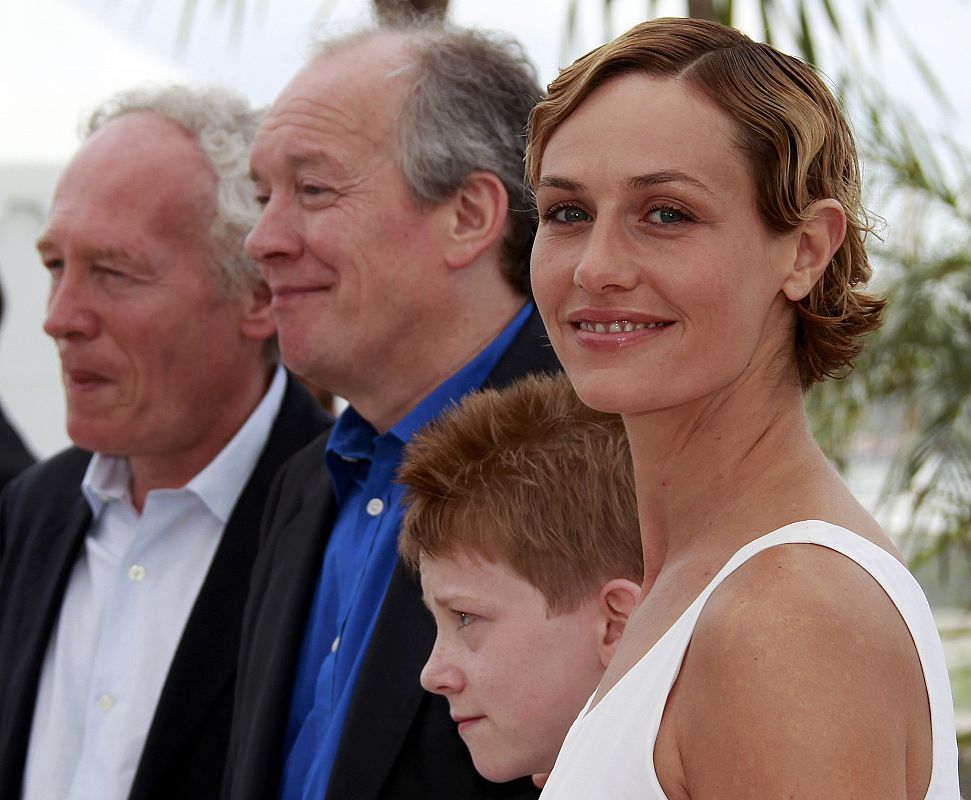 Directors Jean-Pierre and Luc Dardenne pose with cast members Doret and De France during a photocall  for the film Le Gamin au velo" in competition at the 64th Cannes Film Festival